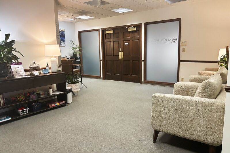 The Rock River Counseling Center reception and waiting area with comfortable seating